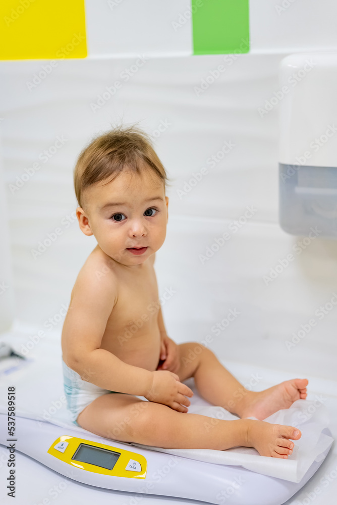 Cheerful small child smilling. Cute little boy sitting.