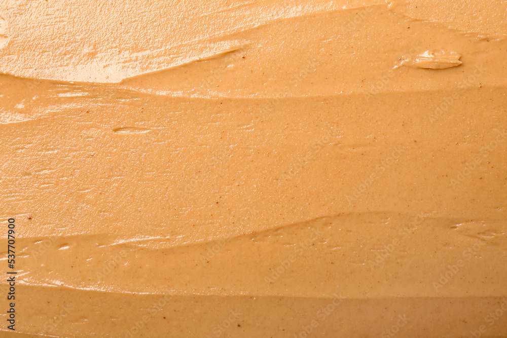 Texture of nut butter as background, closeup