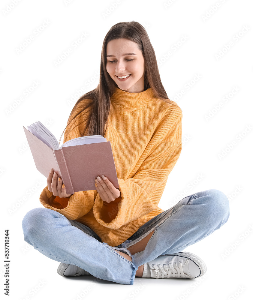 Beautiful woman in yellow sweater reading book on white background