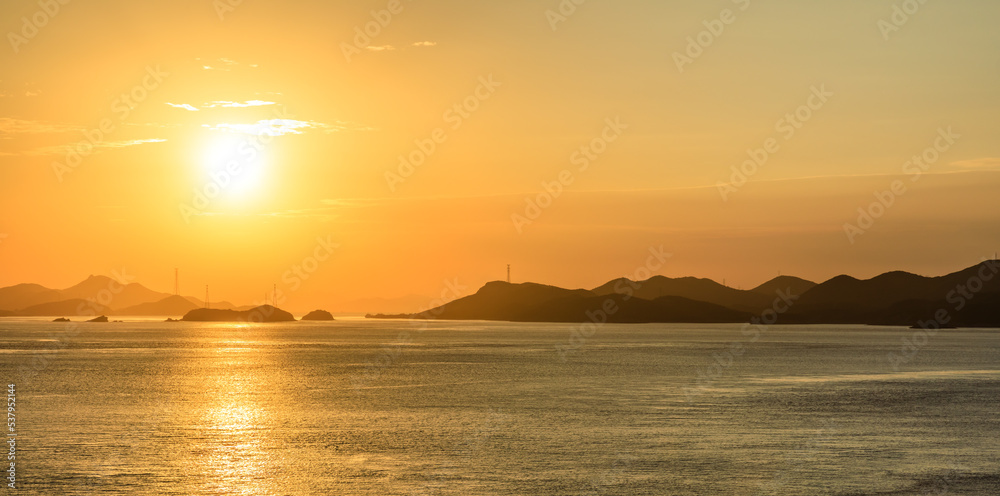 Beautiful sea and mountain with colorful sky clouds natural scenery at sunset