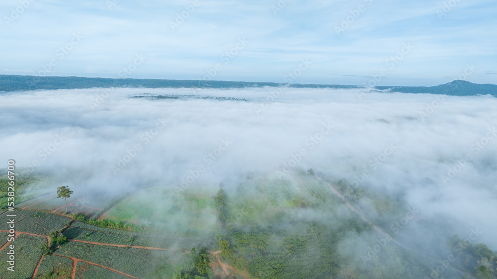 Mountains in fog at beautiful autumn in Phetchabun Thailand. Fog mountain valley, low clouds, forest