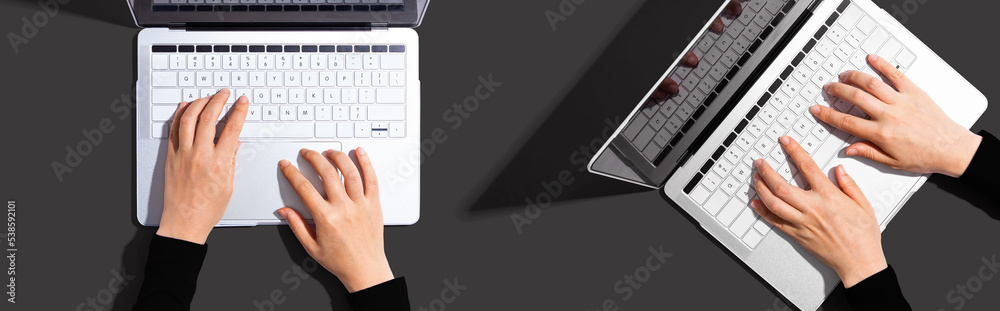 Two people working together with laptop