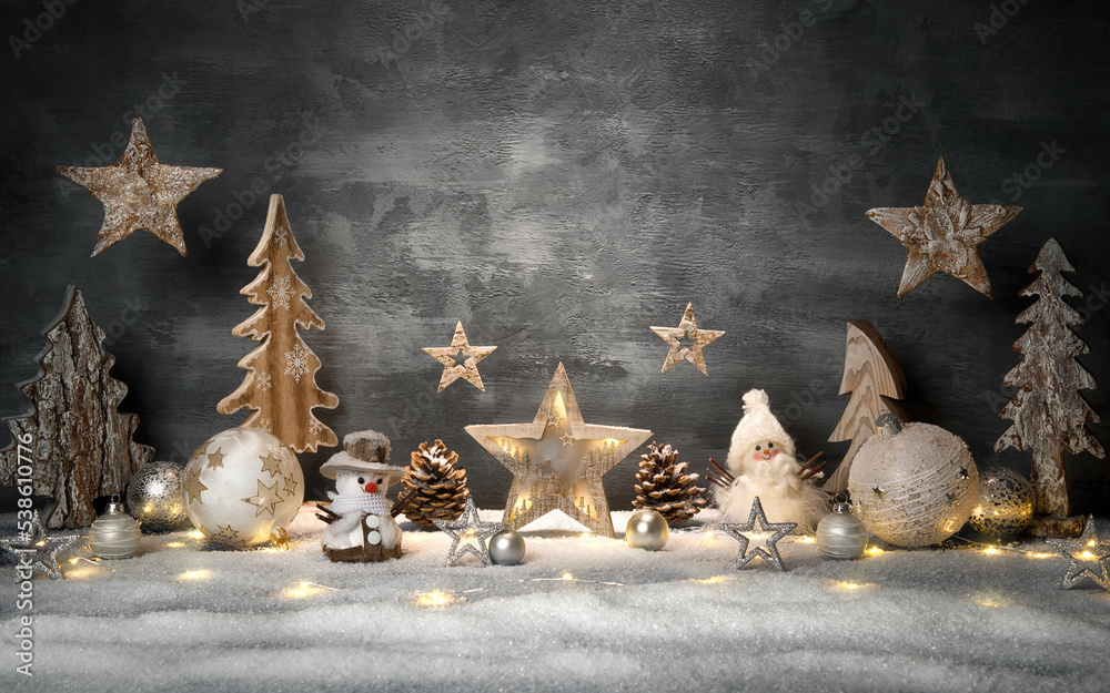 Christmas decoration set with gray stylish background and copy-space, hanging stars and bright ornam