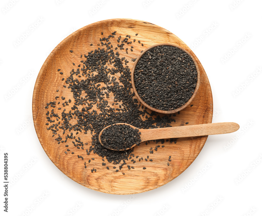 Wooden plate with bowl and spoon with black sesame seeds on white background