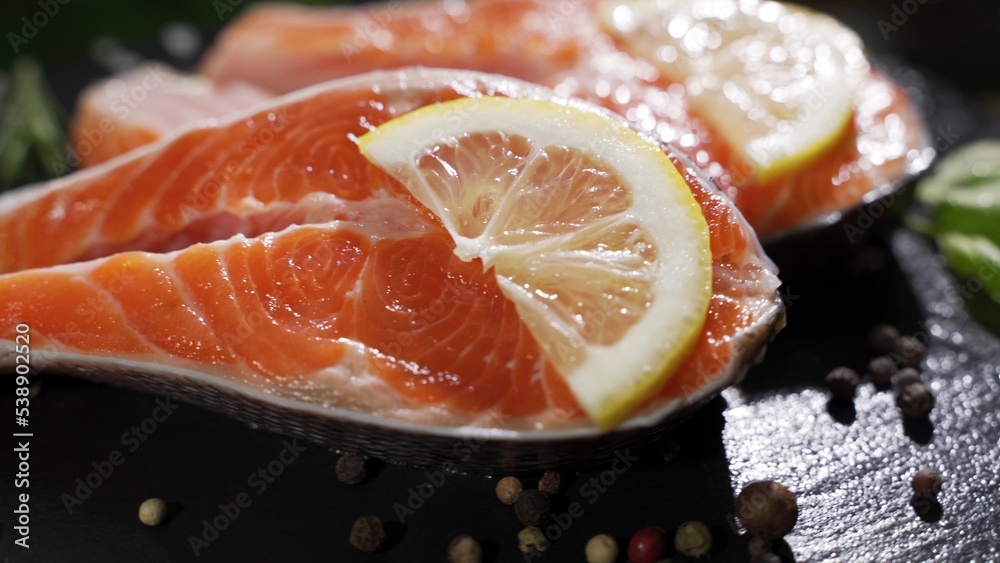 Close up rotation view of seasoning process of salmon’s fillet.