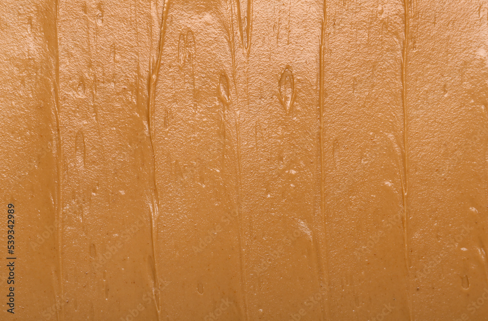 Texture of nut butter as background, closeup