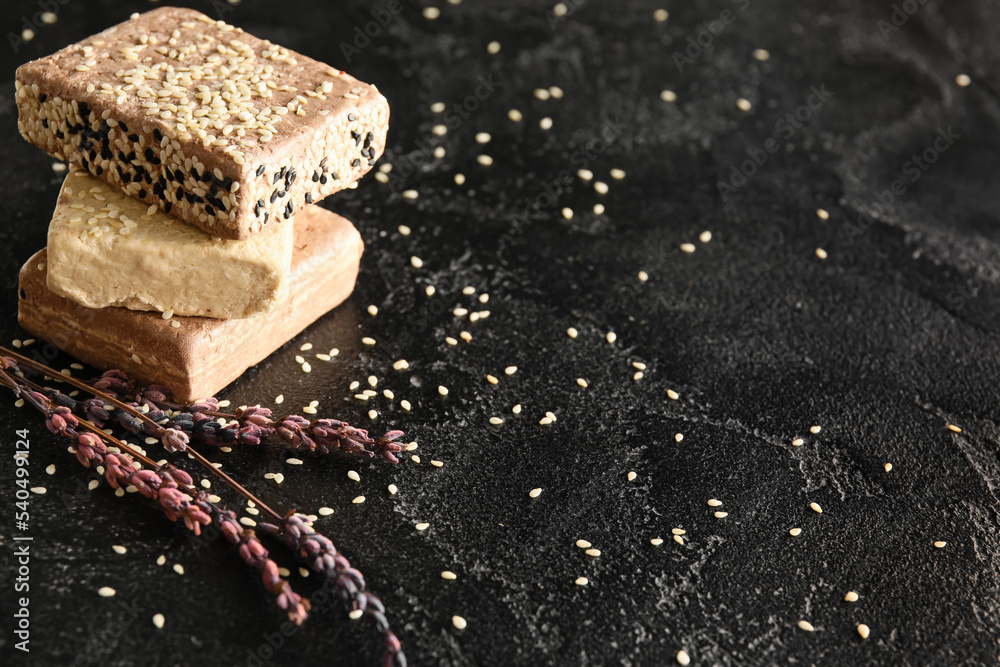 Pieces of sweet sesame halva on dark background