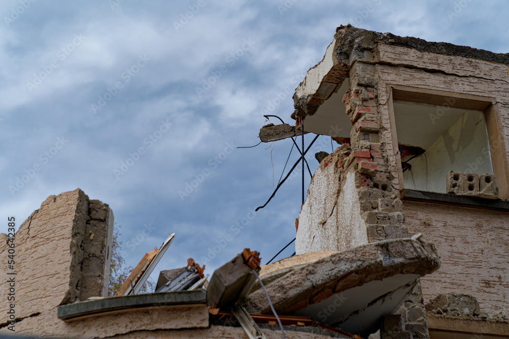 Close-up of wrecked facade at deconstruction site of apartment building at City of Zürich on a cloud