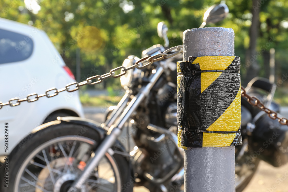 Parking limiter with black and yellow stripes, closeup