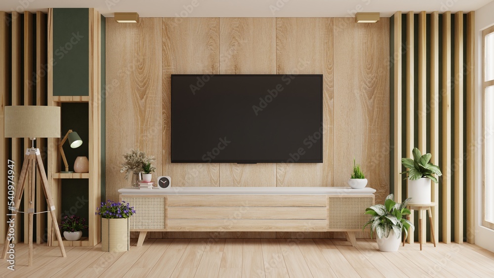 TV LED on cabinet in modern living room on wooden wall background.