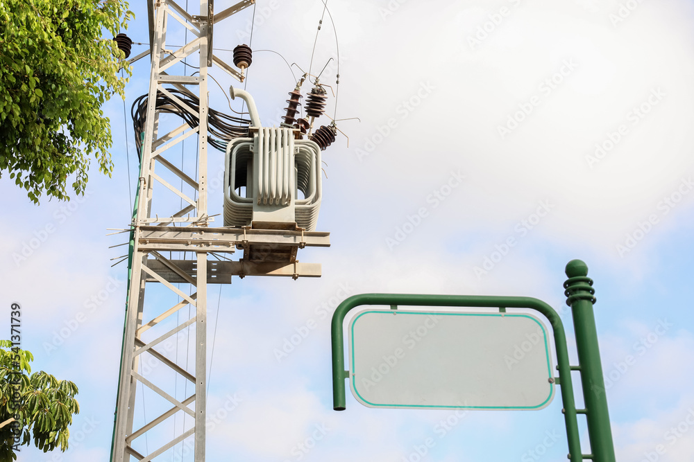 View of electric pole and blank signboard in city, closeup