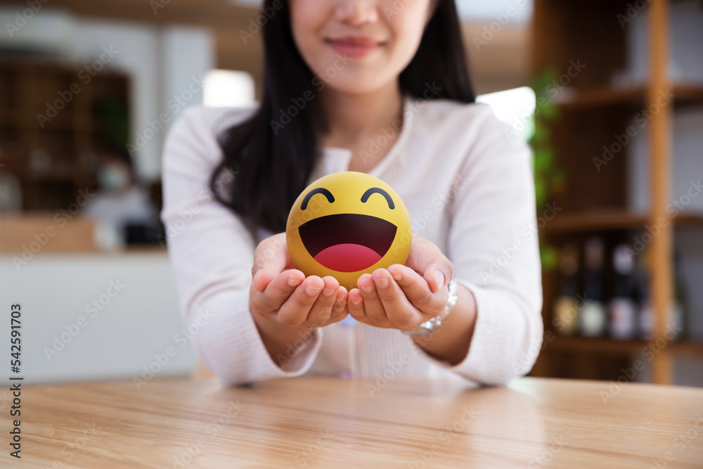 Asian teenager showing smiley emoticon on hands, Happiness, Client giving positive review and feedba