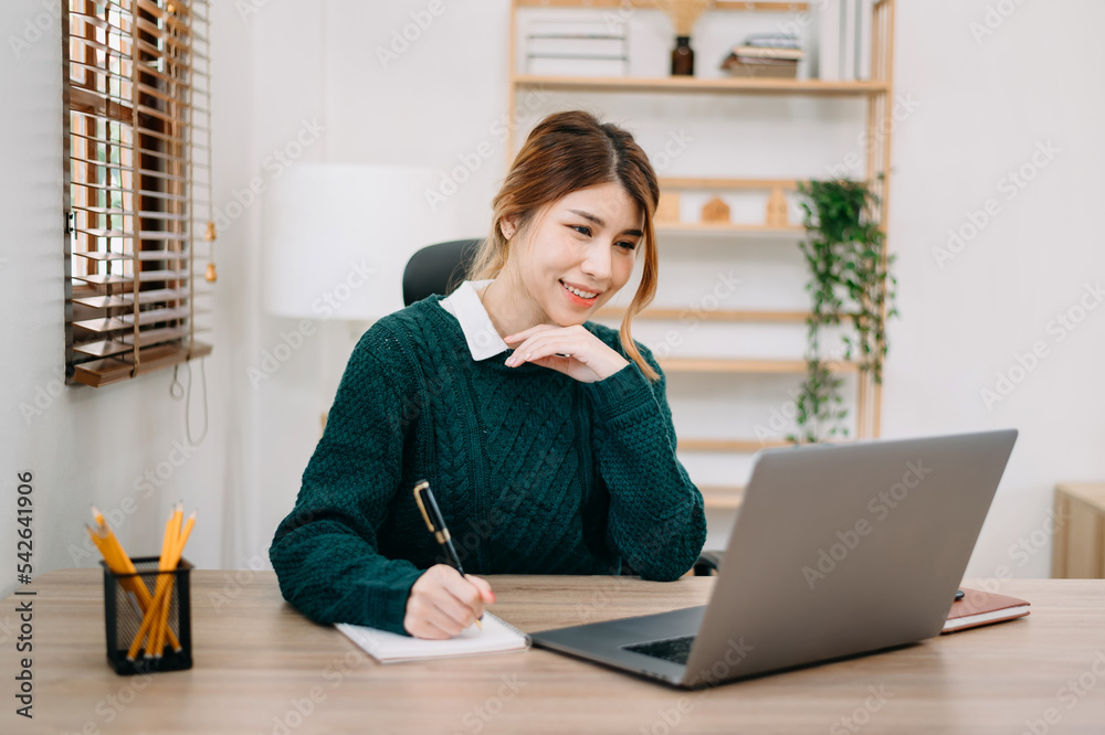 businesswoman hand working with new modern computer and writing on the notepad strategy diagram as c