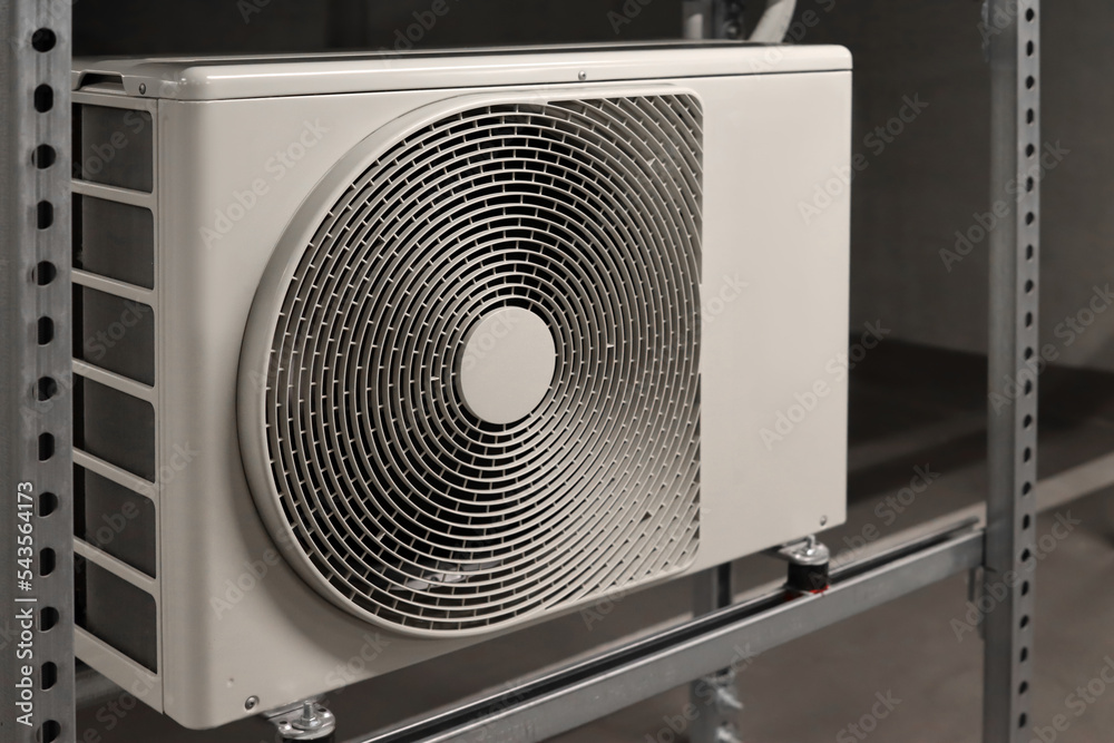 Shelving unit with air conditioner in underground parking lot