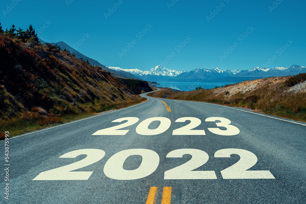 2023 New Year road trip travel and future vision concept . Nature landscape with highway road leadin