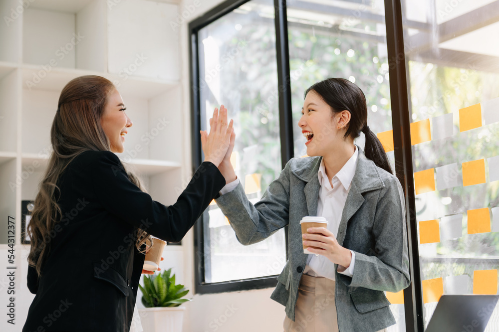 Business Show me the joy hi five hands With women executives celebrating the success of the company.