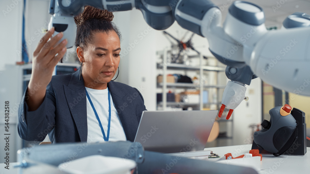 Portrait of Black Female Senior Engineer Working on Engineering Project, Coding on Laptop and Changi