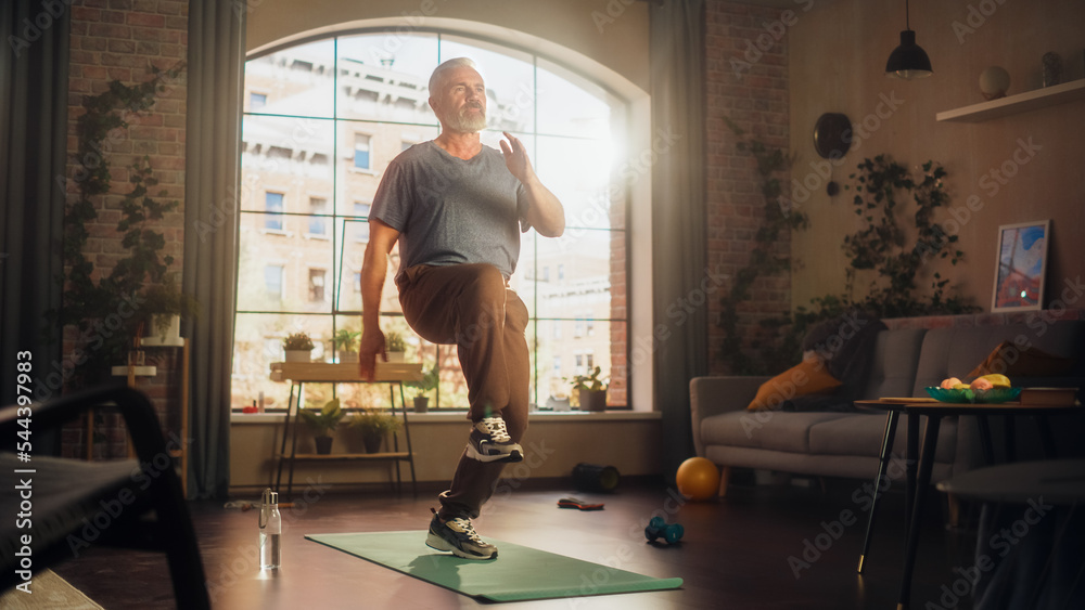 Strong Athletic Fit Middle Aged Man Doing Cardio Core and Knee Strengthening Exercises During Mornin