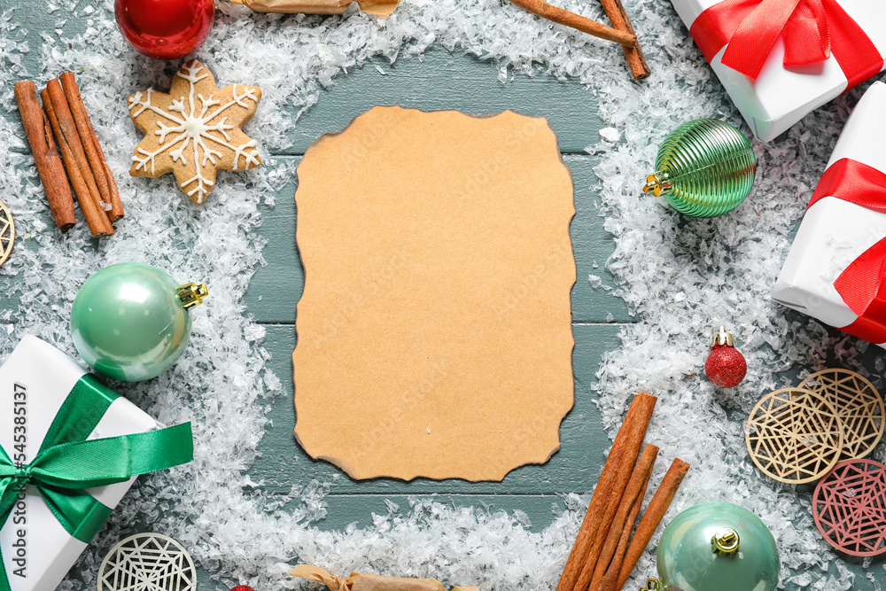 Composition with blank letter to Santa, Christmas decorations, sweets and snow on color wooden backg