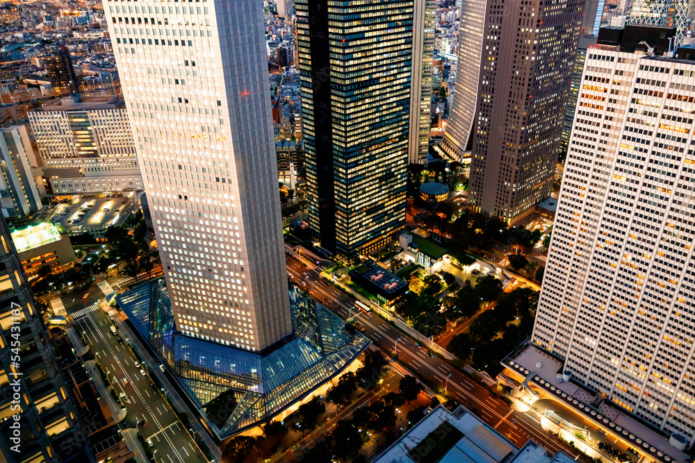 Skyscrapers towering over the cityscape of Nishi-Shinjuku, Tokyo, Japan at sunset