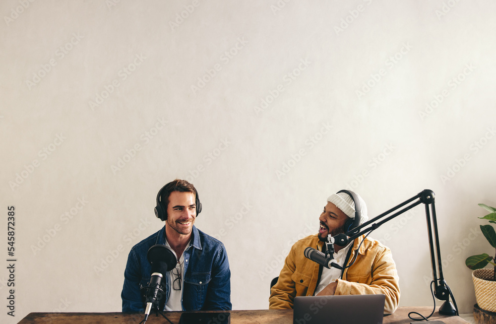 Male podcaster interviewing a guest on his show