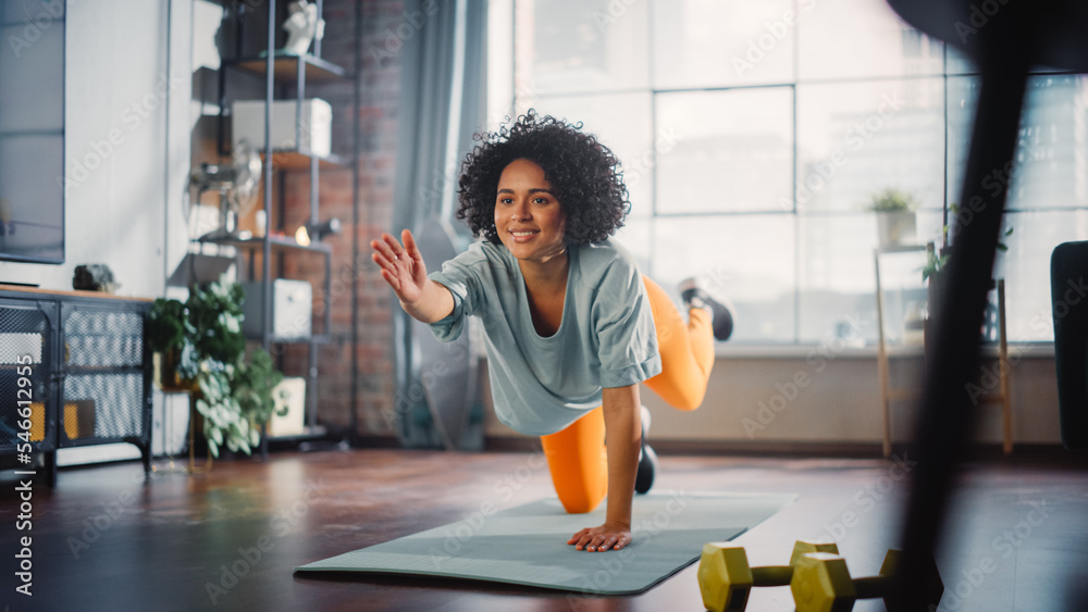 Beautiful Black Girl Doing Fitness at Home, Stretching Her Legs During the Morning. Authentic Woman 