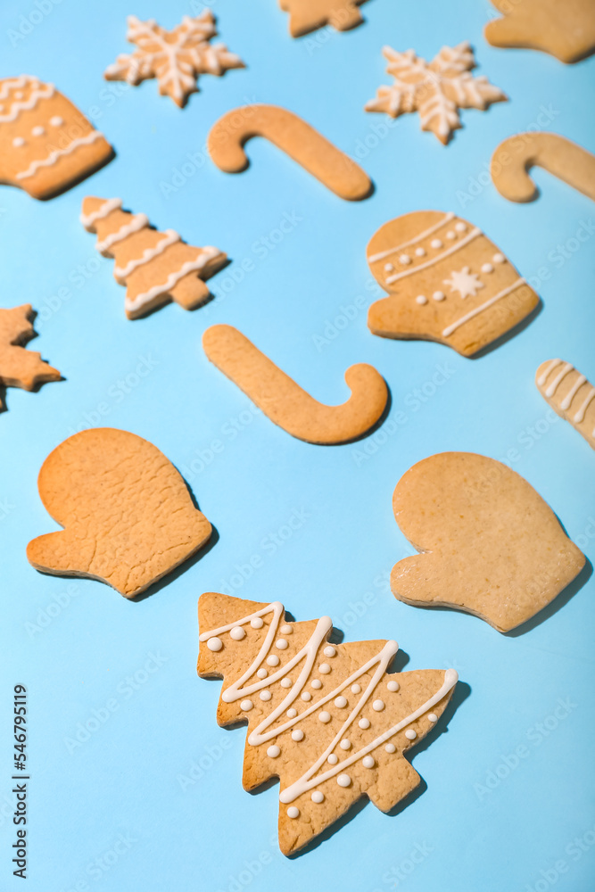 Set of tasty Christmas cookies on color background