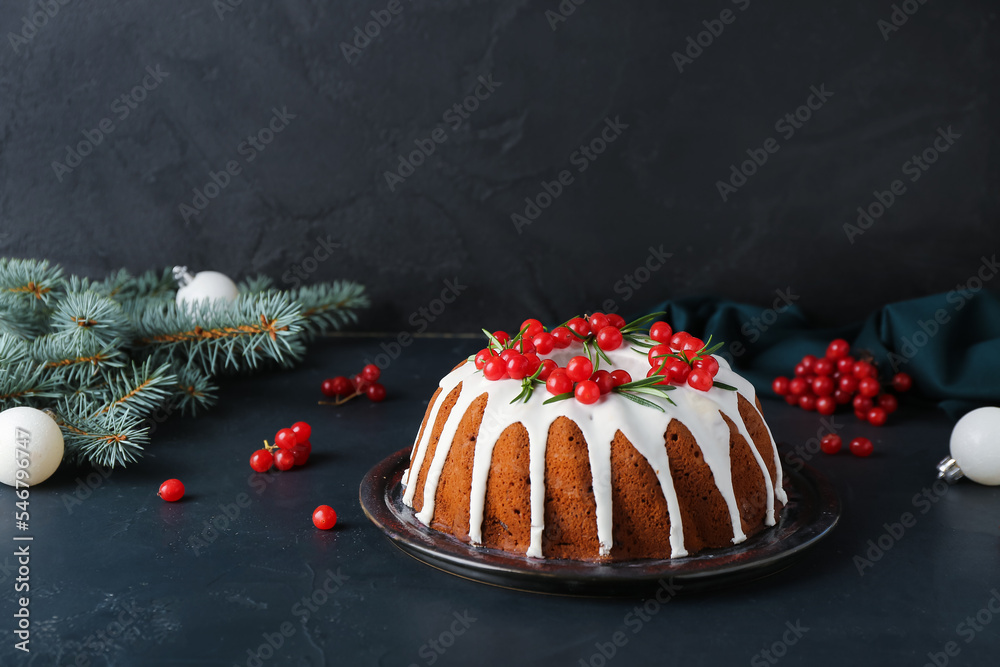 Traditional Christmas cake with cranberry on dark background