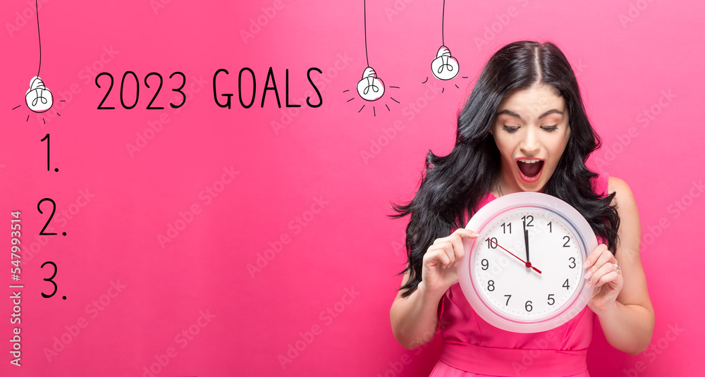 2023 goals with young woman holding a clock showing nearly 12