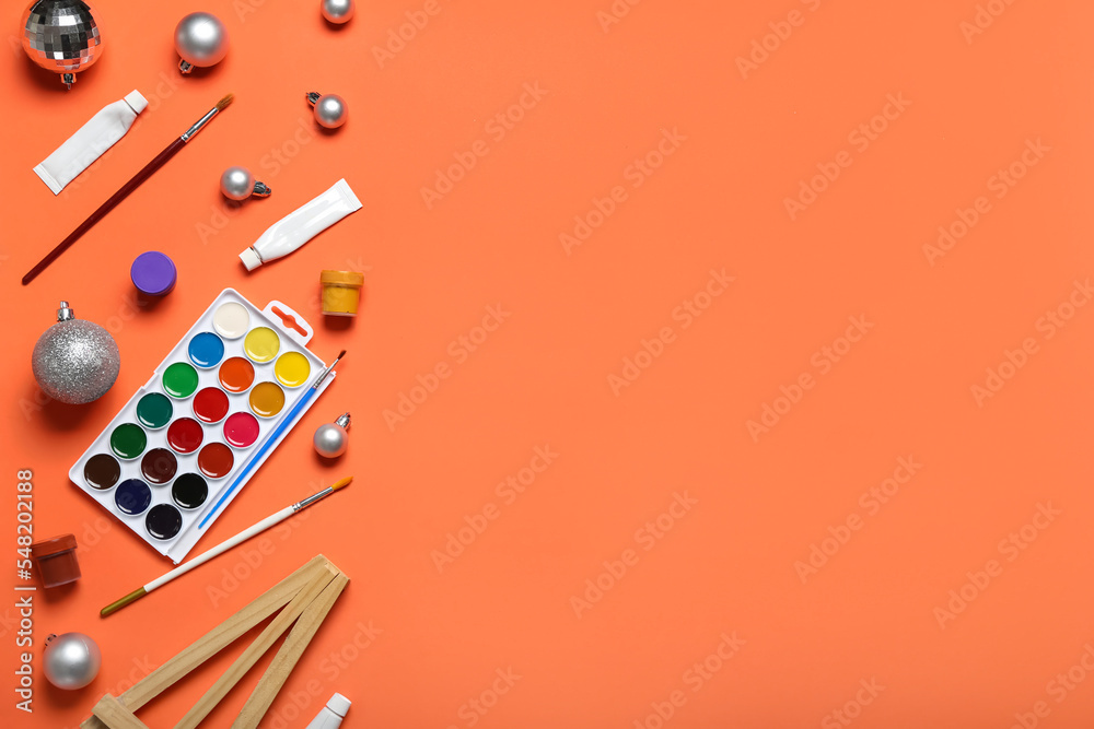 Painter tools with Christmas balls on red background