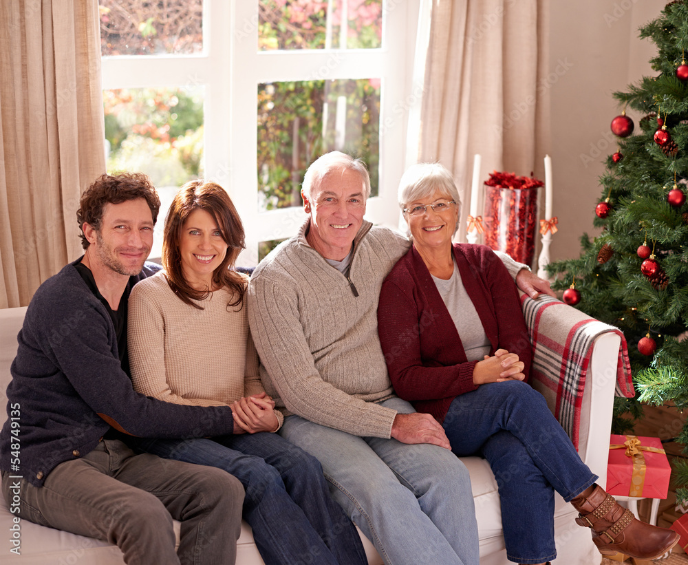 Christmas, family and together on sofa for portrait in living room to celebrate festive holiday. Qua