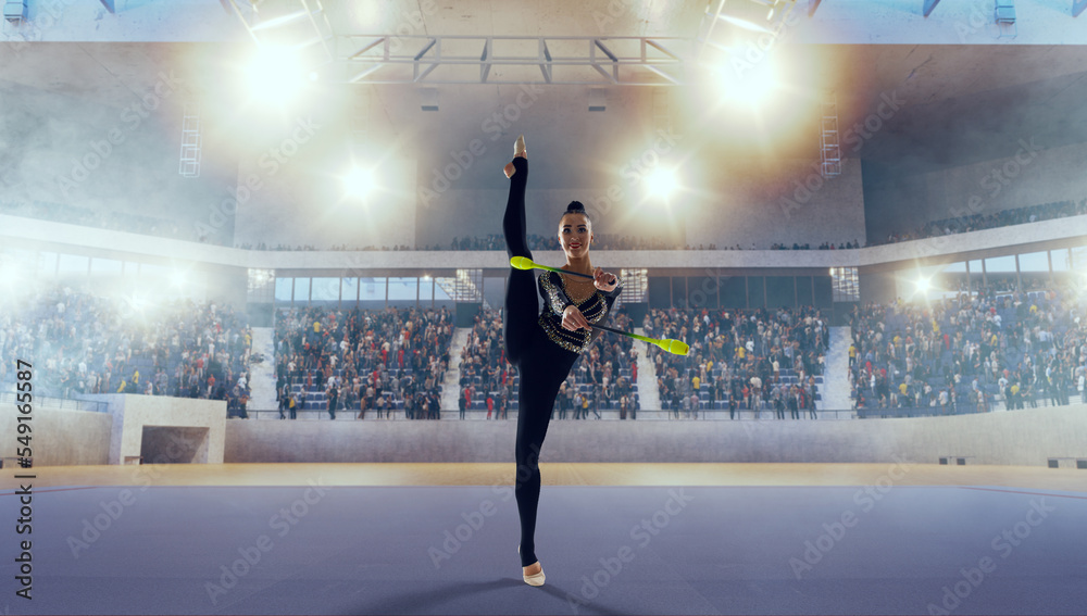 Rhythmic gymnast in professional arena.