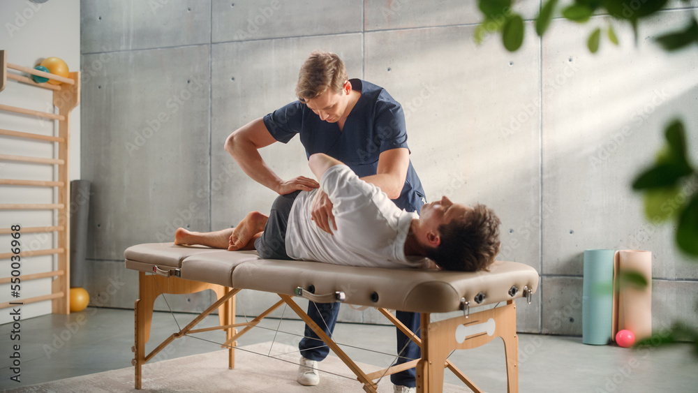 Sportsman Patient Undergoing Physical Therapy in Clinic to Recover from Surgery and Increase Mobilit