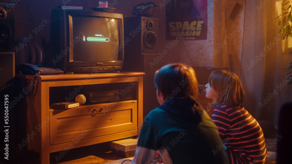 Nostalgic Childhood Concept: Young Boy and Girl Playing Old-School Arcade Video Game on a Retro TV S