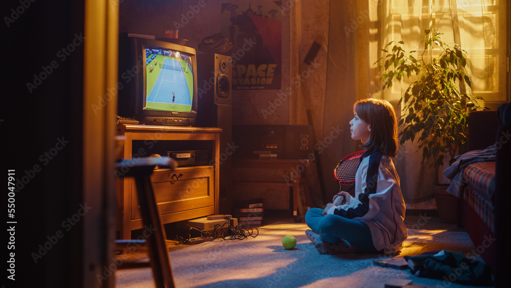 Young Sports Fan Watches a Tennis Match on TV at Vintage Home. Curious Girl Supporting Her Favorite 