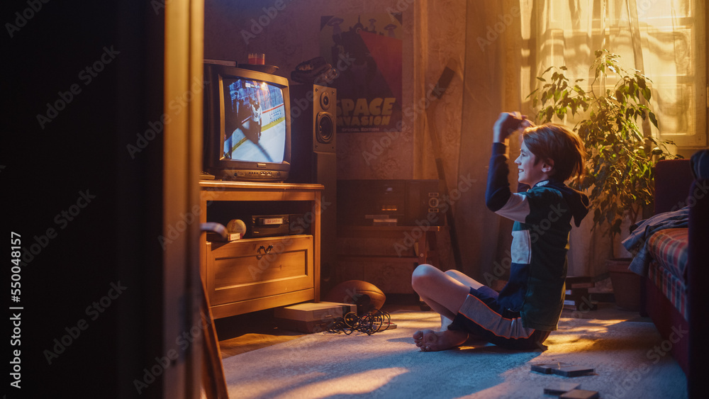 Nostalgic Retro Childhood Concept. Young Boy Watches Hockey Match on TV in His Room with Dated Inter