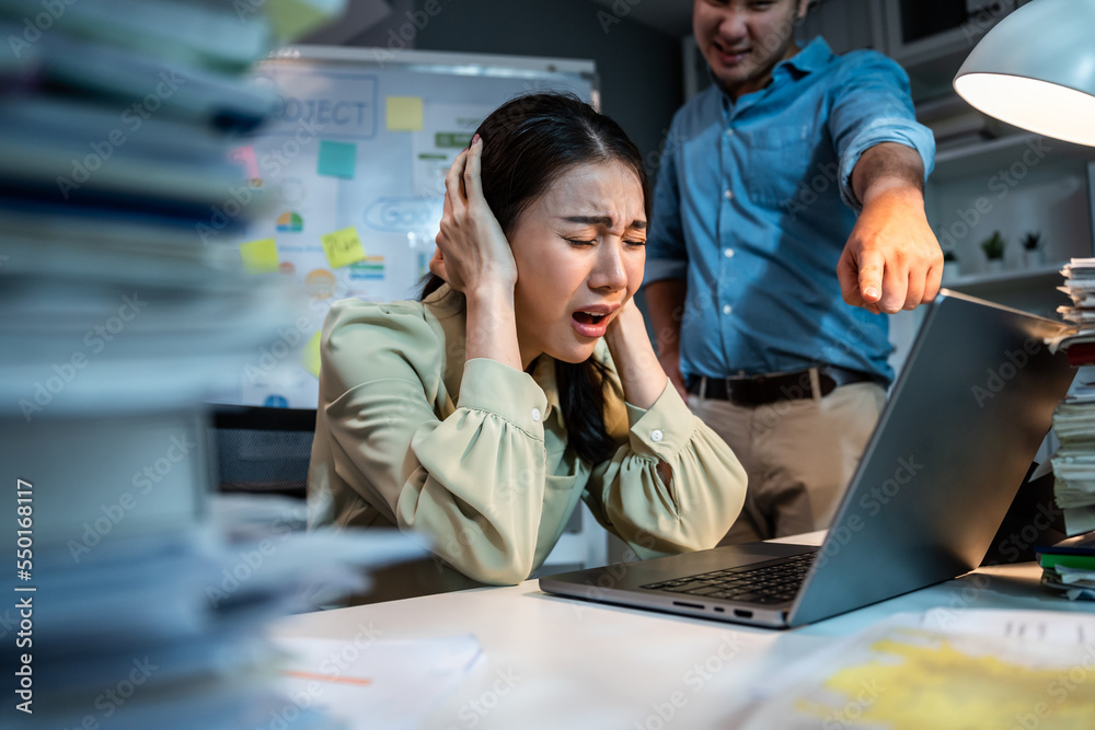 Asian frustrated angry businesswoman follow direction from boss in office. 