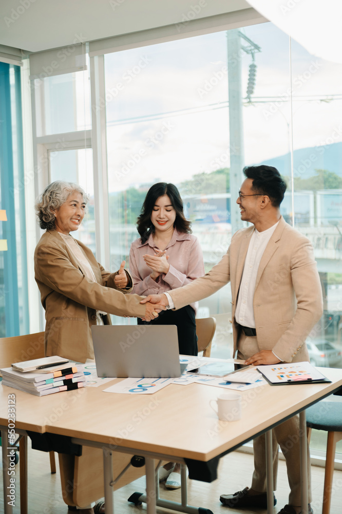 business people shaking hands during a meeting in office