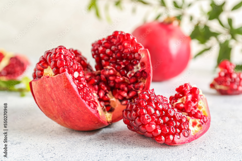 Fresh ripe pomegranate on light background