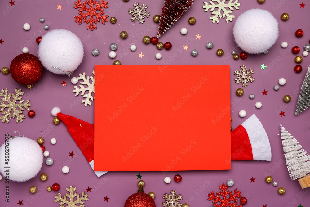 Composition with blank card and different Christmas decorations on color background