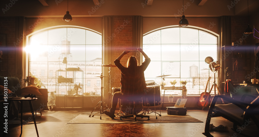 Person Playing Drums During a Band Rehearsal in a Loft Studio with Sunlight at Daytime. Drummer Prac