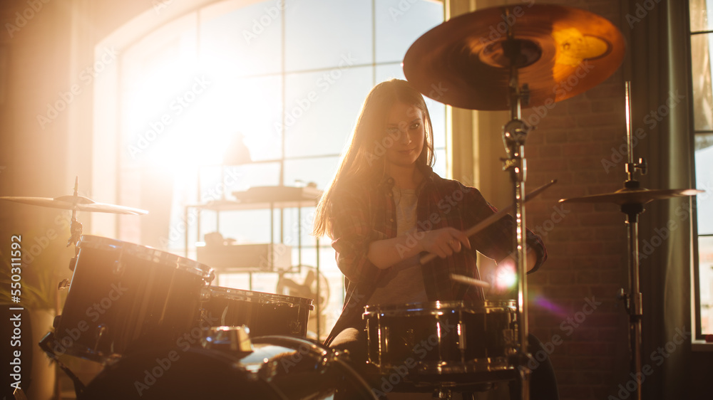 Expressive Drummer Girl Playing Drums in a Loft Music Rehearsal Studio Filled with Light. Rock Band 