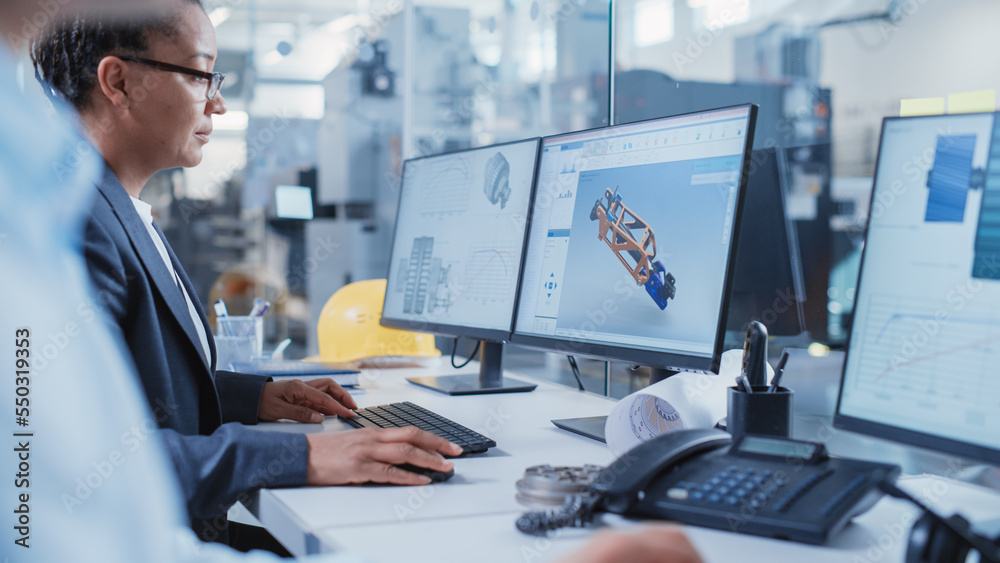 Factory Office Facility: Industrial Engineers Drafting Blueprints of a Heavy Industry Machine Parts 