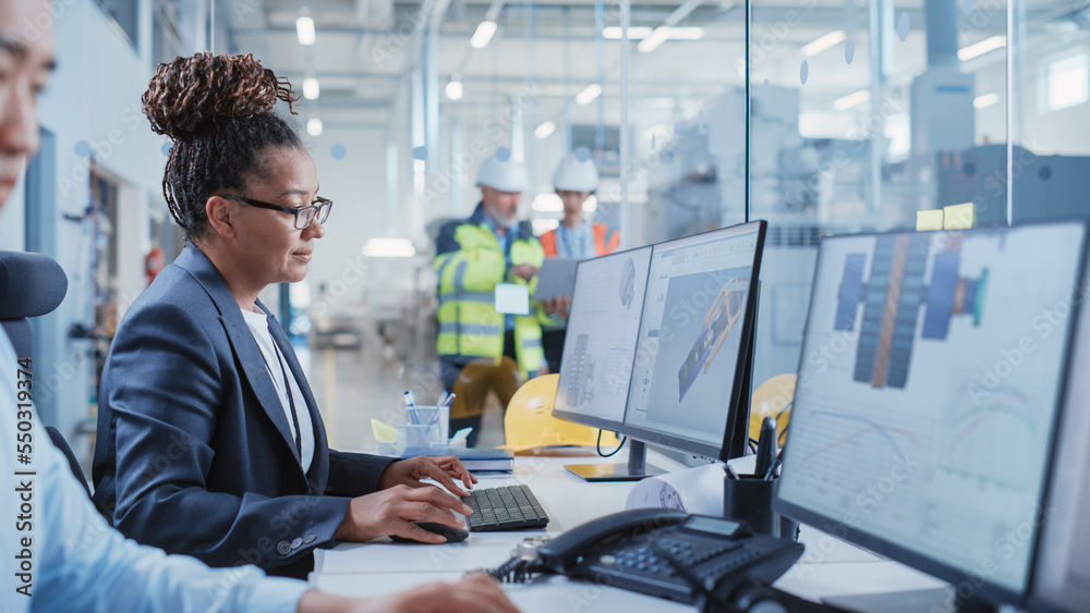 Portrait of an Industrial Engineer Drafting Blueprint of a Heavy Industry Machine Parts on a Compute