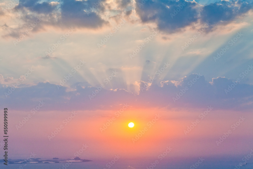 Stunning sunset clouds above the ocean