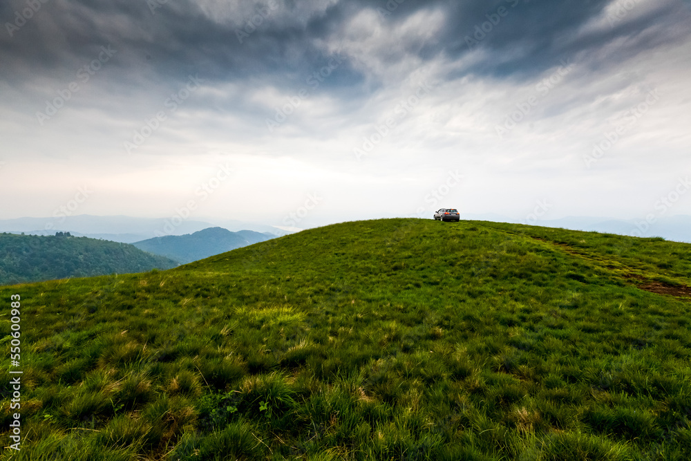 Green hills and valleys in the Alps mountains in Italy