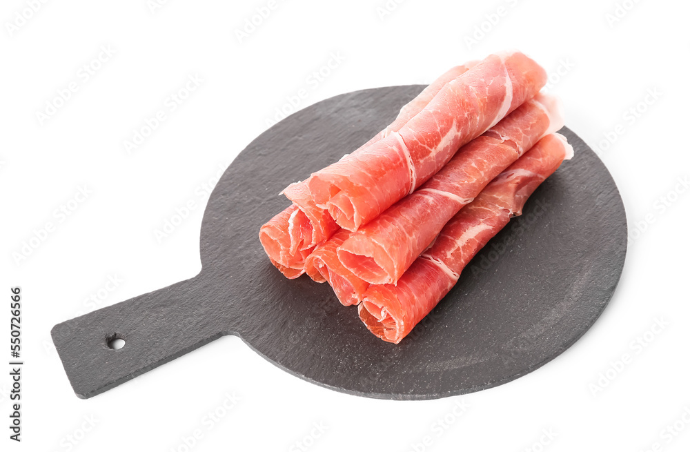 Slate board with rolled slices of tasty ham on white background