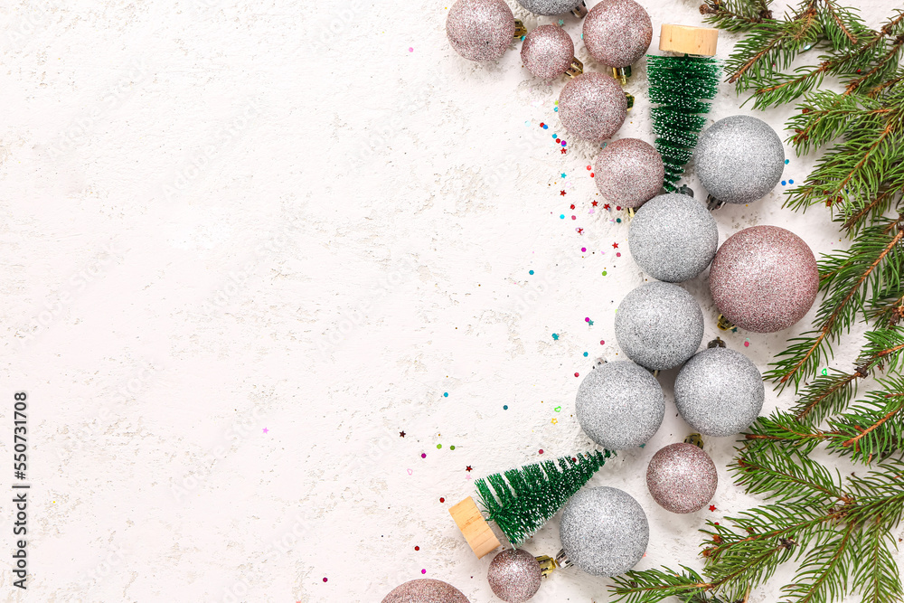 Christmas balls with fir trees and branches on white background