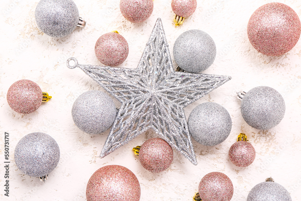 Shiny Christmas balls with star on white background