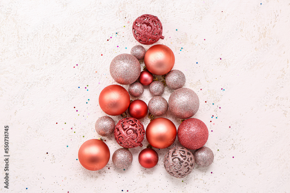 Christmas tree made of shiny Christmas balls on white background